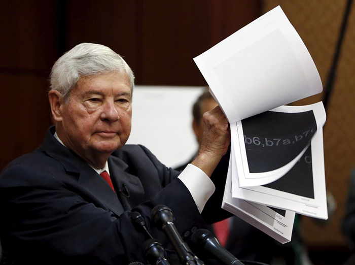 Bob Graham displays 28 pages that are still classified, and blacked out, of a U.S. government report on who financed the September 11 attacks