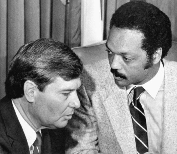 Bob Graham speaks to Jesse Jackson in 1984 during a voter registration drive